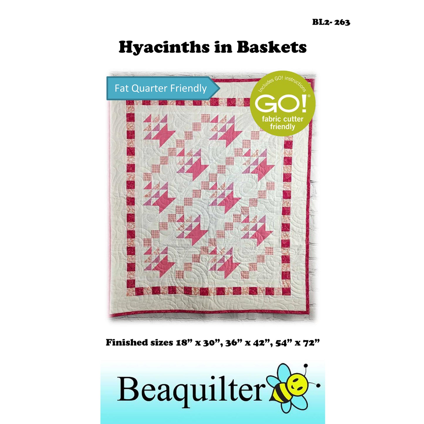 Pink and White quilt with baskets in  diagonal rows with upside down triangles inside to make them look like flowers and a border of small squares.