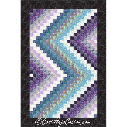 A vibrant quilt showcasing stripes which is called Bargello in shades of purple, blue, and white.
