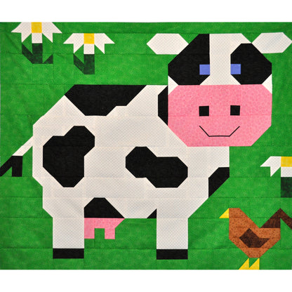 Adorable cow quilt block with some flowers and a chicken.
