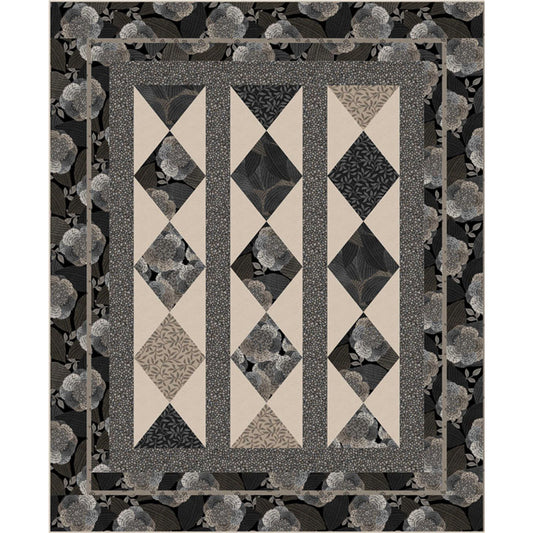 Monochrome quilt featuring a black and white diamond design, perfect for adding a touch of elegance to any room.