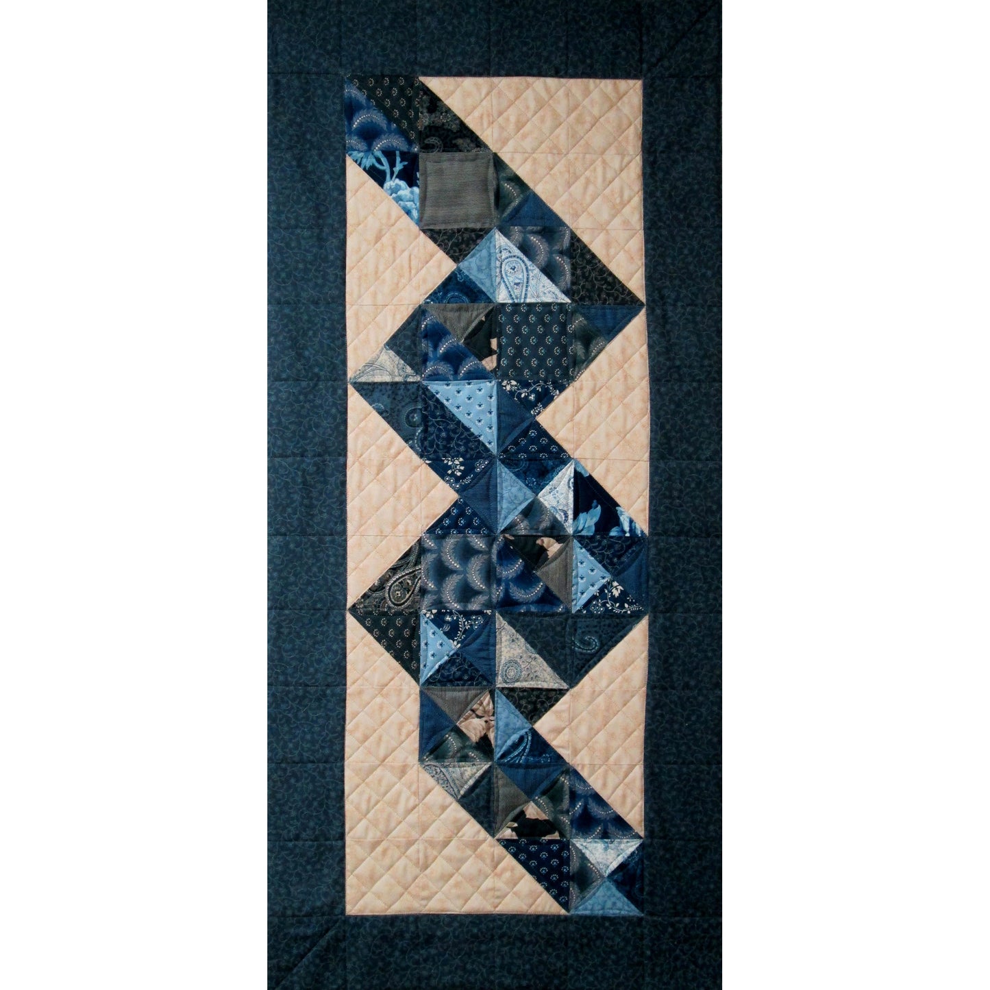 Vibrant table runner featuring colorful squares in shades of blue with a dark blue border.