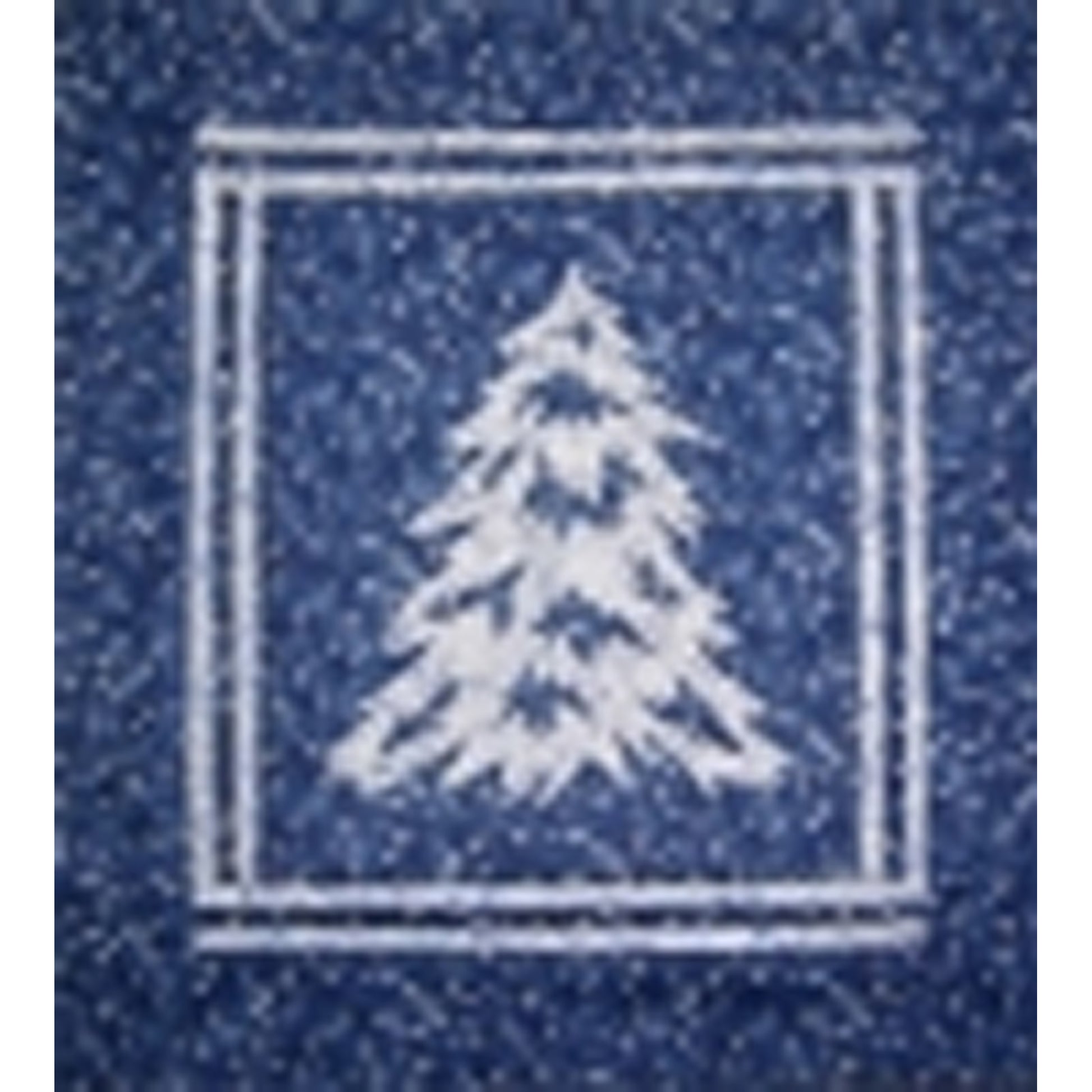 Quilt of a white evergreen tree/outline on a blue background.