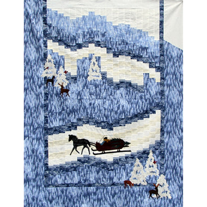 A Quilt in blues and white featuring a horse and sleigh on a snowy trail through the woods with some deer.