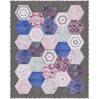 Quilt with purple and pink hexagon design.