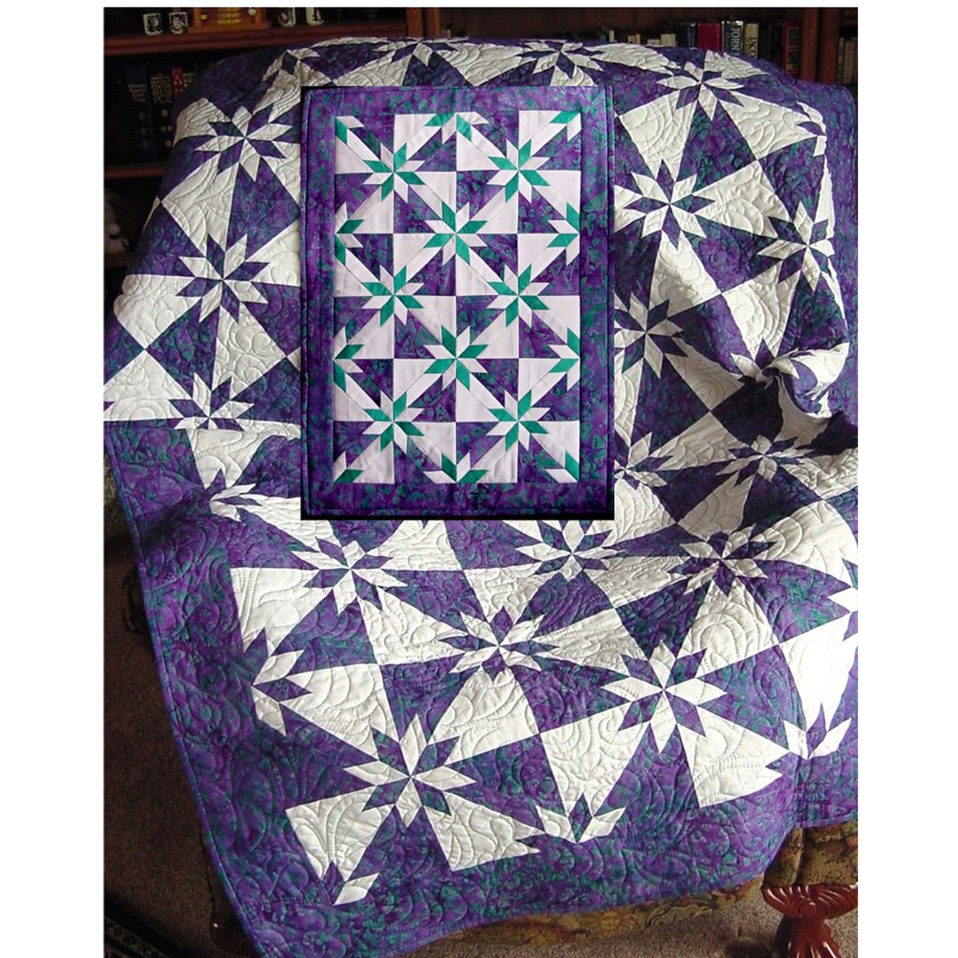 Quilt in purple and white showcasing a star pattern, hunter's star block style. Small image inset shows quilt pattern done in purple and white backgound with teal and white stars. 